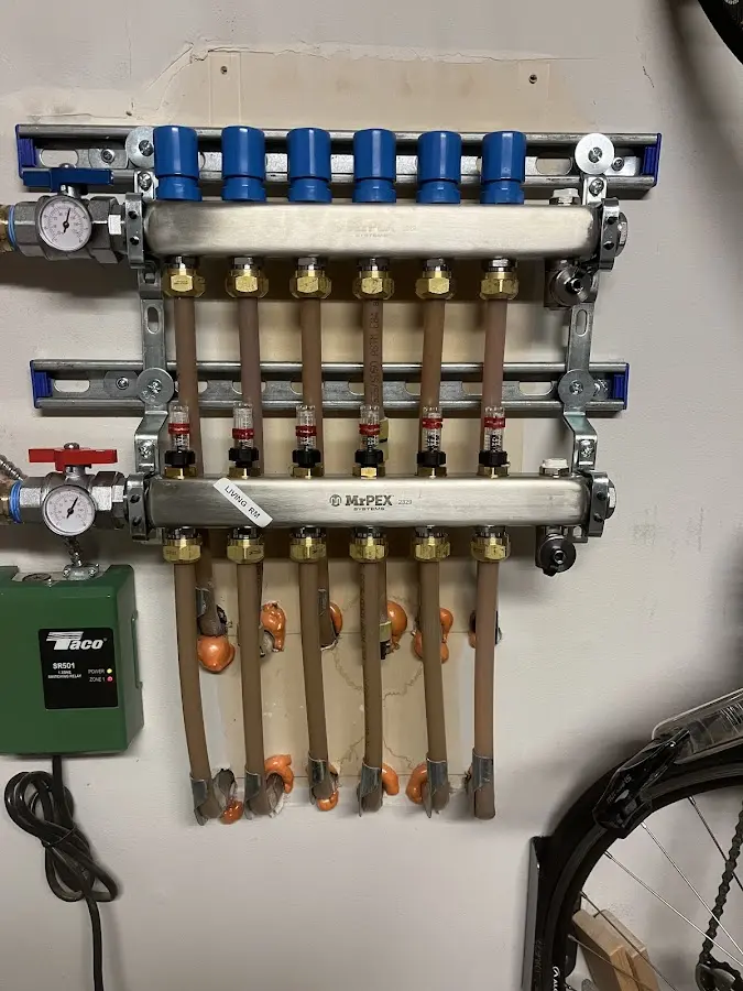 Plumber performing Water Heater Repair at a residential property in Oostburg